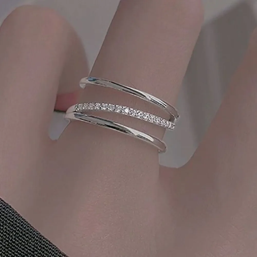- The Triple Bling Ring adjustable in  925 silver & cubic zirconia